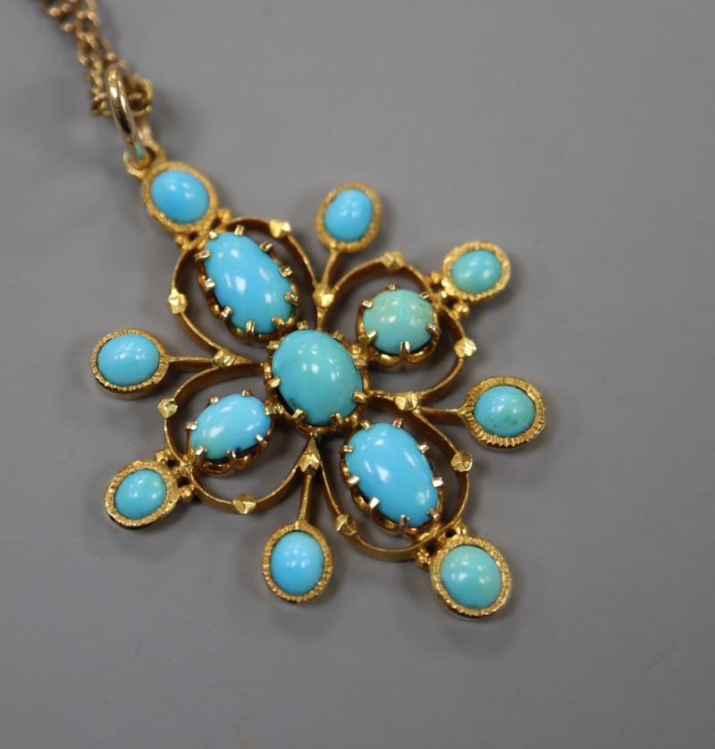 An early 20th century yellow metal and turquoise set pendant, on a yellow metal chain, pendant 4cm, gross 10 grams.